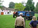 Village Green, 06:30 3rd June 2002.
Andy McKenzie arrives from Taplow Court with load of wood for cook-fire.
Bill Ball and Jane Curry in foreground.
House decked with flags for Queen's Jubilee in the background.