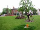 Village Green, with ox-roast in progress.
Pub and houses in the background decked with flags for the Queen's Jubilee.