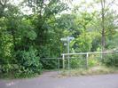 Entrance to public footpath along the bank of the River Thames at Maidenhead Rowing Club.
Trees, railings, footpath signs.