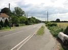 Looking south on Marsh Lane.
House behind trees on left.
Footway and fields on right.