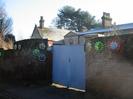 Gates of The Old Rectory, with hubcaps found and decorated by Sheila Horton.