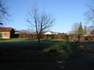 Western part of Village Green. Barn on left, School visible above the hedge.
Part of School House on the right.