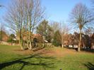 Eastern part of Village Green.
Houses on High Street visible through the trees.