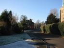 Looking West on Rectory Road.
St Nicolas House in the centre, and part of St Nicolas Church on the right.
Frost in shaded areas.
SLOW road marking.