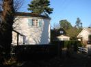 Eastern part of Wellbank Cottage.
Garages and part of Lindens visible on the right.