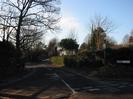 Looking West up Rectory Road.
Wellbank Cottage and St Nicolas Church visible over the hedge.
Road signs on the right.