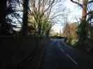 Looking North on Boundary Road.
Footpath and wall on left.
Bus-stop sign. 30-limit repeater sign.
Rectory Road junction in the distance.