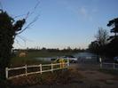 The entrance to Boundary Road Stables.
White fence, yellow bins, parked car, and horse.
Frost on grass and clear blue sky.
A bit surreal.