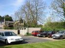 Car park and garages at Eastern end of Cedar Chase.
Rear of houses 18 and 19 in the background.