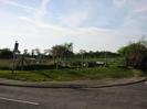 Looking across the entrance to Buffins.
Wire fence with allotment gardens behind.
Road-name sign for Buffins.
No through road sign.
