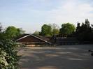 Rear view of St Nicolas School, with playground and trees.