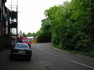 Looking north on Mill Lane.
Cars and scaffolding on the left.
Trees on the right.