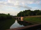 Jubilee River with bridge across Mill Lane.
Dark trees on the horizon.
