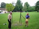 Village Green.
Bill Ball and Jane Curry with ox-roasting frame, preparing for the Village Green party on 3rd June 2002.