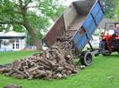 Village Green 06:40 3rd June 2002.
Andy McKenzie tipping wood for ox-roast.