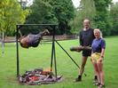 Village Green, 09:10 3rd June 2002.
Ox Roast in progress.
Andrew Findlay and Jane Curry stoking the fire.