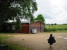 Wooden club hut with gravel car-park