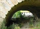 Looking north through one of the side arches of Maidenhead Bridge.
Corrugated iron boat shed, with derelict boat.