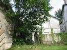 Derelict houses at eastern end of Maidenhead Bridge.
Part of bridge visible on the left.
Grass and trees.