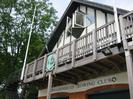 Maidenhead Rowing Club.
Wooden balcony with flagpoles and coat of arms.