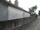 Eastern end of Maidenhead Bridge, with derelict houses behind parapet.