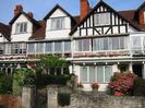 The middle of Gaiety Row:
Rippledene, Two Bridges, Marlborough, Apple Tree Cottage.
Black and white terraced houses with glassed-in verandas on the first floor.