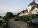 River Road with the Thames on the left.
Maidenhead Bridge in the distance.
Part of Gaiety Row on the right: black and white houses with large verandas at first-floor level.