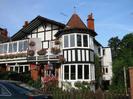 The southern end of Gaiety Row:
Waterside and Regatta View.
Black and white painted houses with large windows at first floor level.