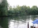 Guards Club Island seen across River Thames.
Boat moored to landing stage on right.