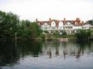 River Thames, with Gaiety Row houses on the far side.
Most houses are white painted with some black timbers, and have red tile roofs.
Steep gardens lead down to the river.
