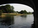 Looking downstream through the Sounding Arch.
Houses and trees on the far bank.