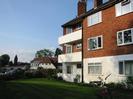 River Court flats: three-storey building with white paint at ground-floor level, red brickwork on upper levels.
Maidenhead Bridge and Rowing Club visible on the left.