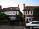 Two-storey houses with bay windows on ground floor.
Rendered at first-floor level.
Red tile roofs.