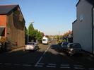 Looking along Byways from Hitcham Road.
House on left has a rendered end wall with much of the render missing from the upper part.
White-painted house on the right.