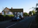 The junction of Hitcham Road and Eastfield Road.
The Maypole public house: white building with black window frames and doors.
Courage brewery sign.