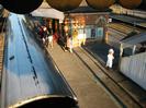 Train on platform 3 with passengers alighting.