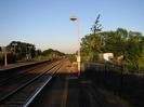 Looking east from Platform 1.
Island platform on left with large mirror on pole.
Red lamp-posts.
Iron railings on right.