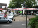 SGT Alfa Romeo showroom.
Cars on forecourt.
Road with signpost.