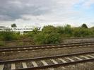 Railway tracks with SGT buildings visible in the background.