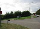 Road junction.
Marsh lane on left joining A4 Bath Road on right.
Road-name signs each side of Marsh Lane.
Grey roadside cabinet.