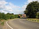 Looking north on Marsh Lane.
Bend in the road with house in the distance.