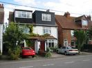 Row of houses with dormer windows in the roofs.