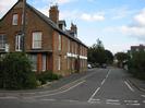 Looking into Ye Meads from Marsh Lane.
Large brick building on the left has an arched entry-way half way along the Ye Meads side.