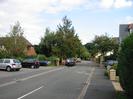 Looking east on Ye Meads.
Parked cars.
Footway and houses on right.