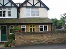 Pair of houses. Brickwork at ground-floor level and rendered above.