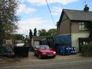 Dee Works: House and yard with skip and barrels.