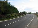 Looking south on Marsh Lane.
Bank of trees on the left.
Bridge over Jubilee River in the distance.