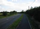 Looking south on Marsh Lane.
Road with footway and trees on the right.