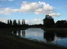 River with low road-bridge.
Trees on both sides.