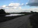 Gravel track with river on left.